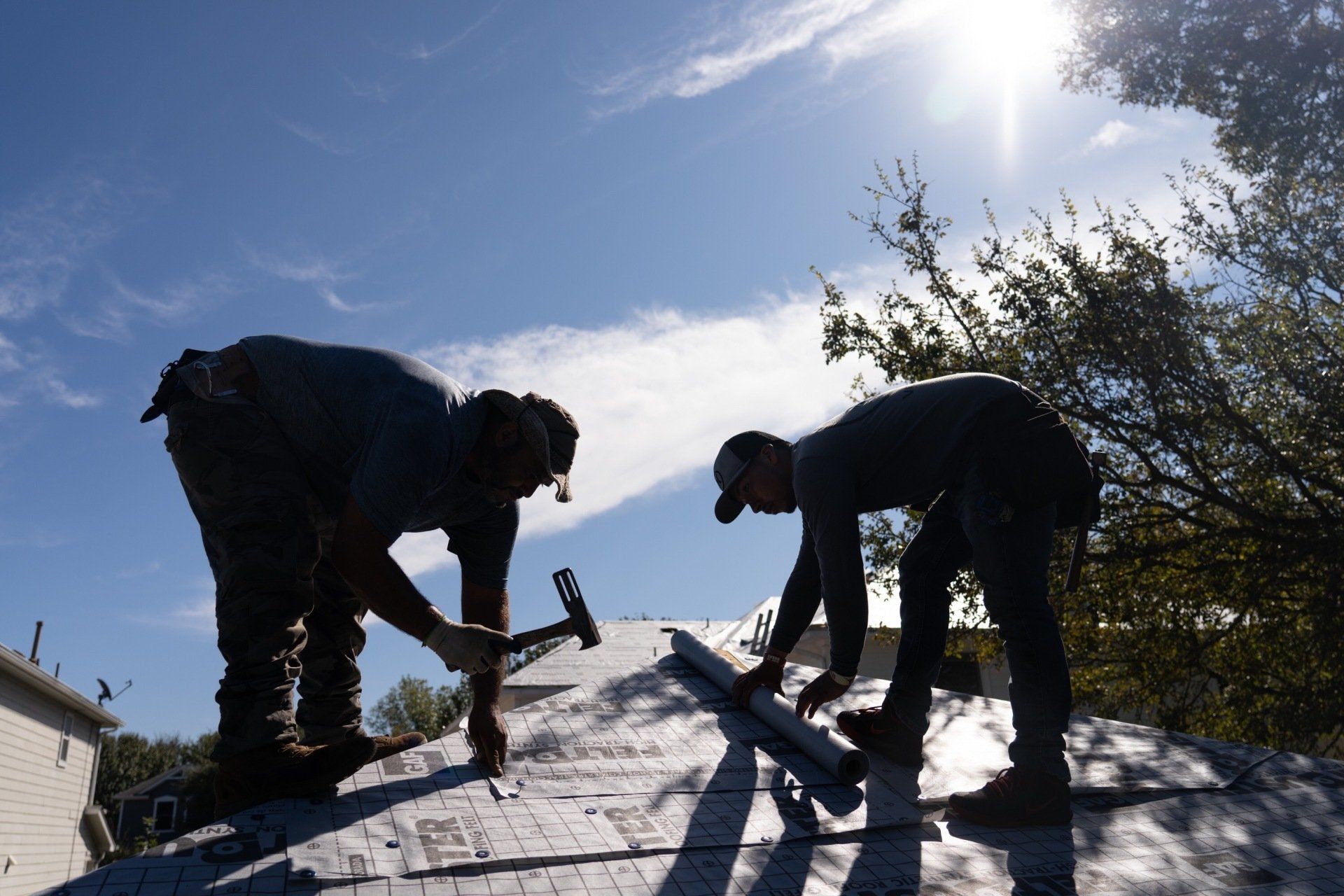 Waco, Texas Roofers on roof helping with a hail damage insurance claim