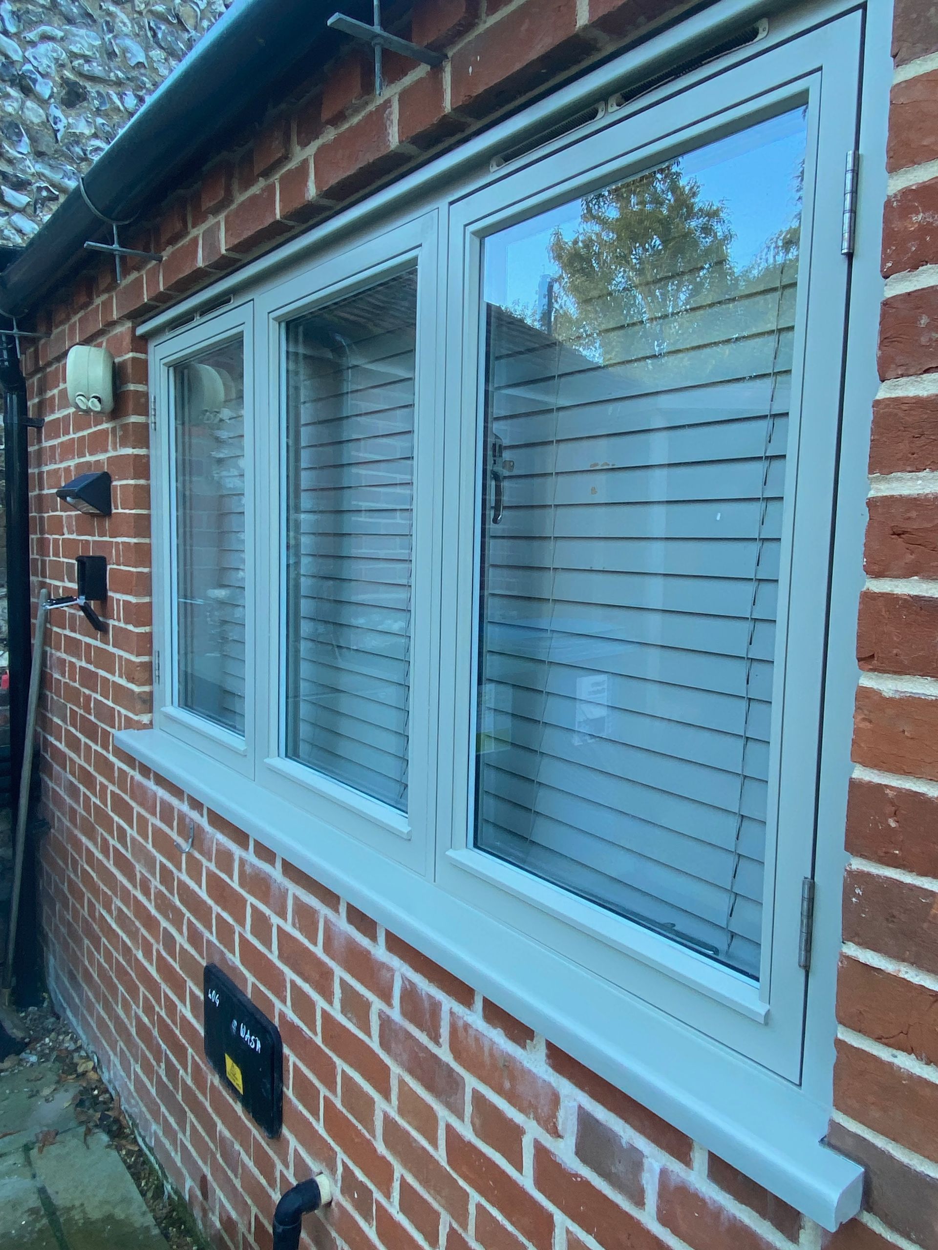 Exterior windows painted in Farrow & Ball 'Hardwick White'