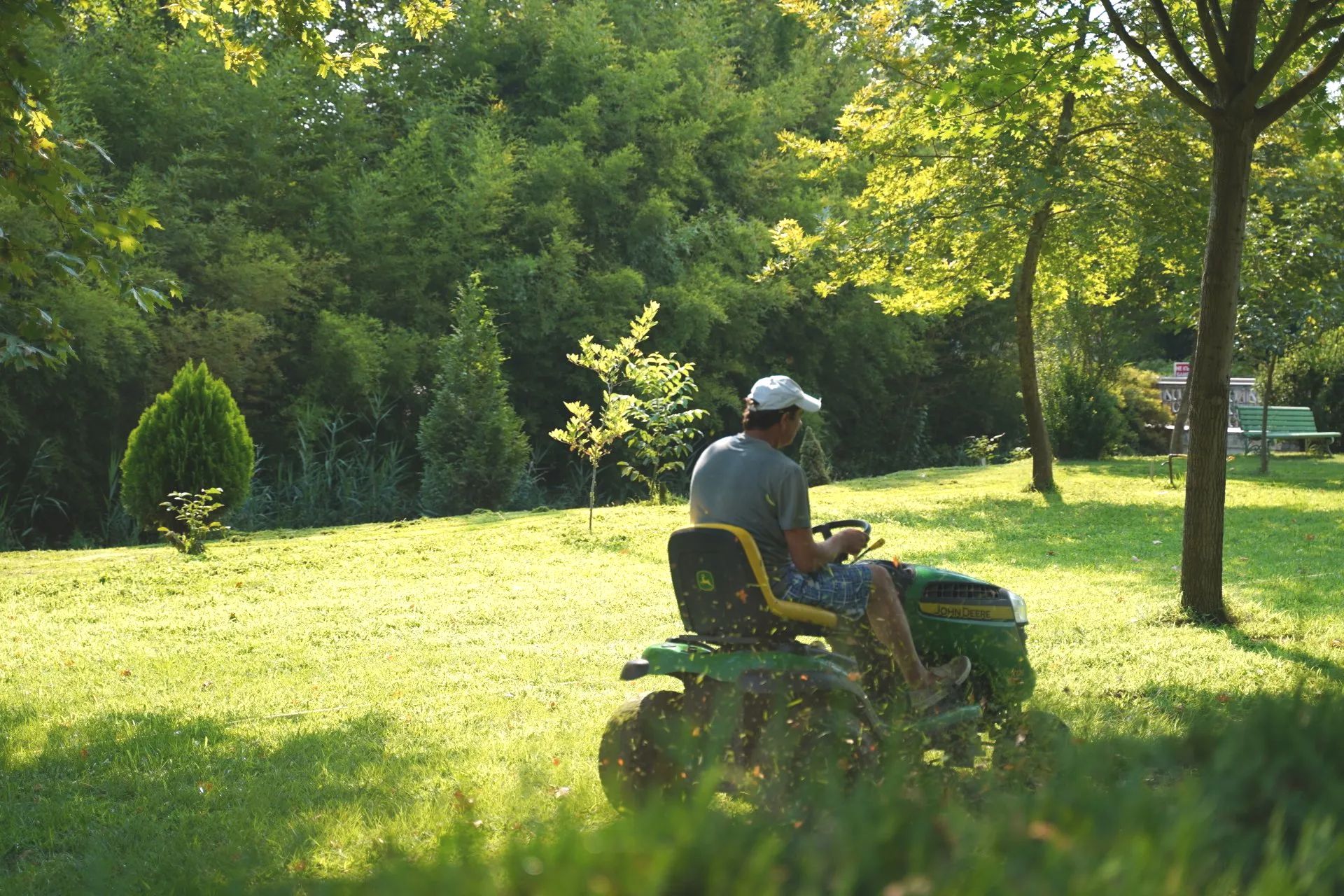 ride on lawn mower cutting grass