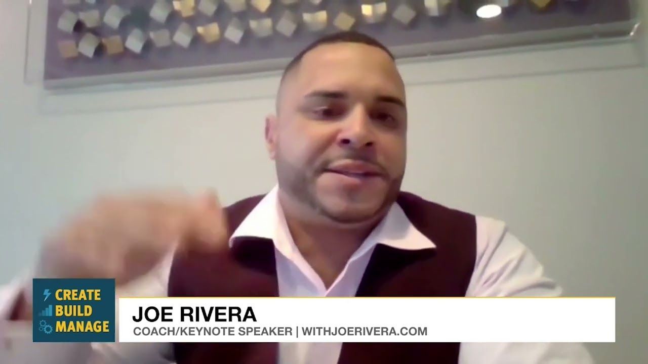 Joe Rivera, coach and keynote speaker, gesturing, speaking into a camera.