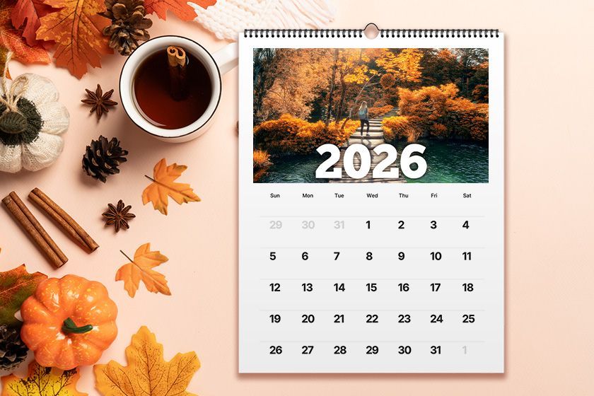 A calendar with flowers on a wooden table