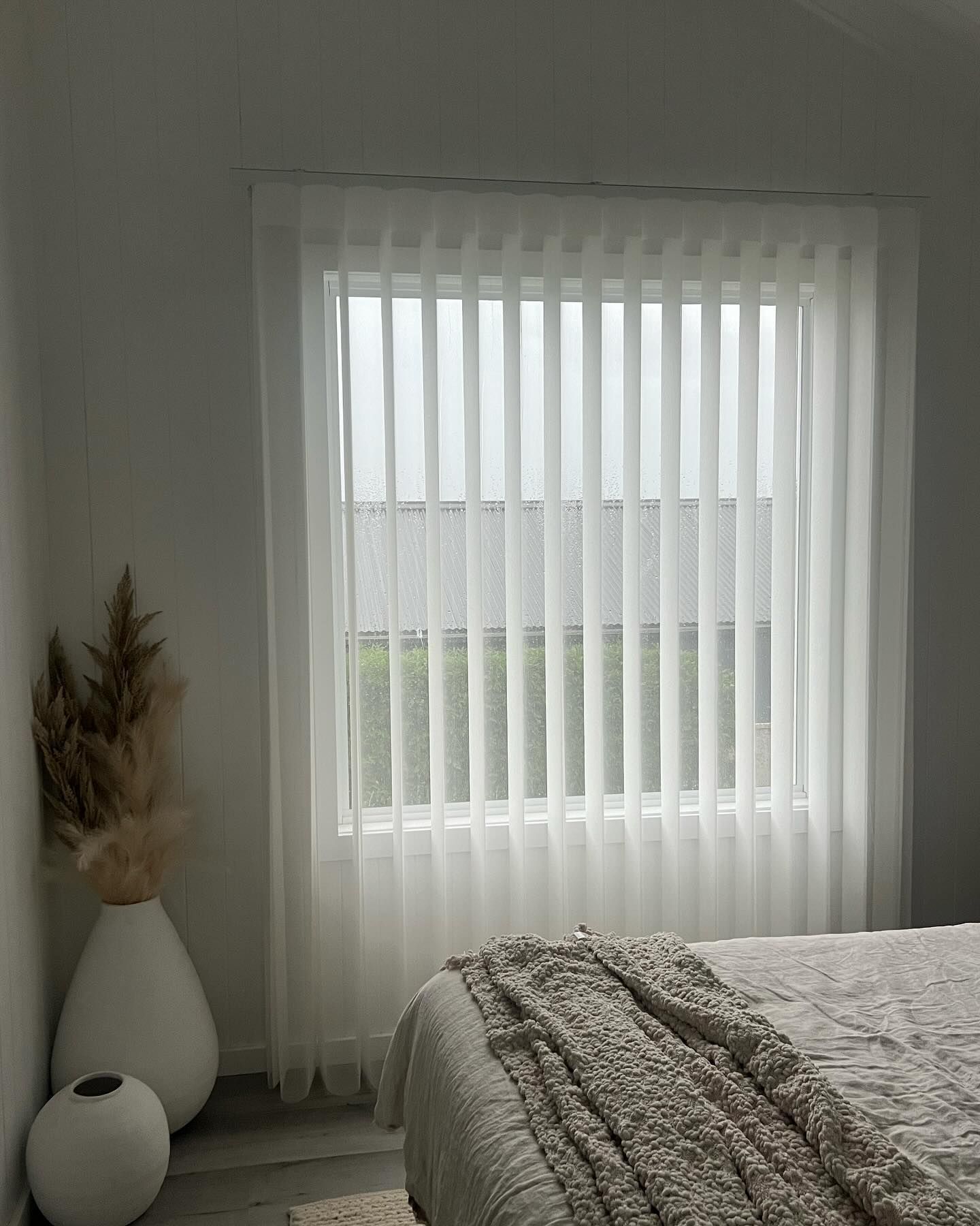 A Living Room with A Couch and Chairs and A Large Window — Douglass Blinds & Security Screens in Goulburn, NSW