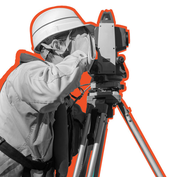A man wearing a hard hat is using a camera on a tripod