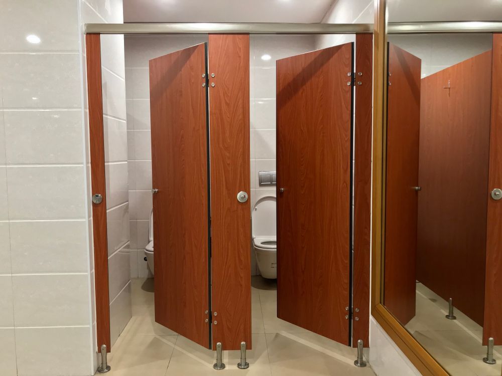 Public Restroom With Three Wooden Stalls — RWM Cleaning in Deception Bay, QLD