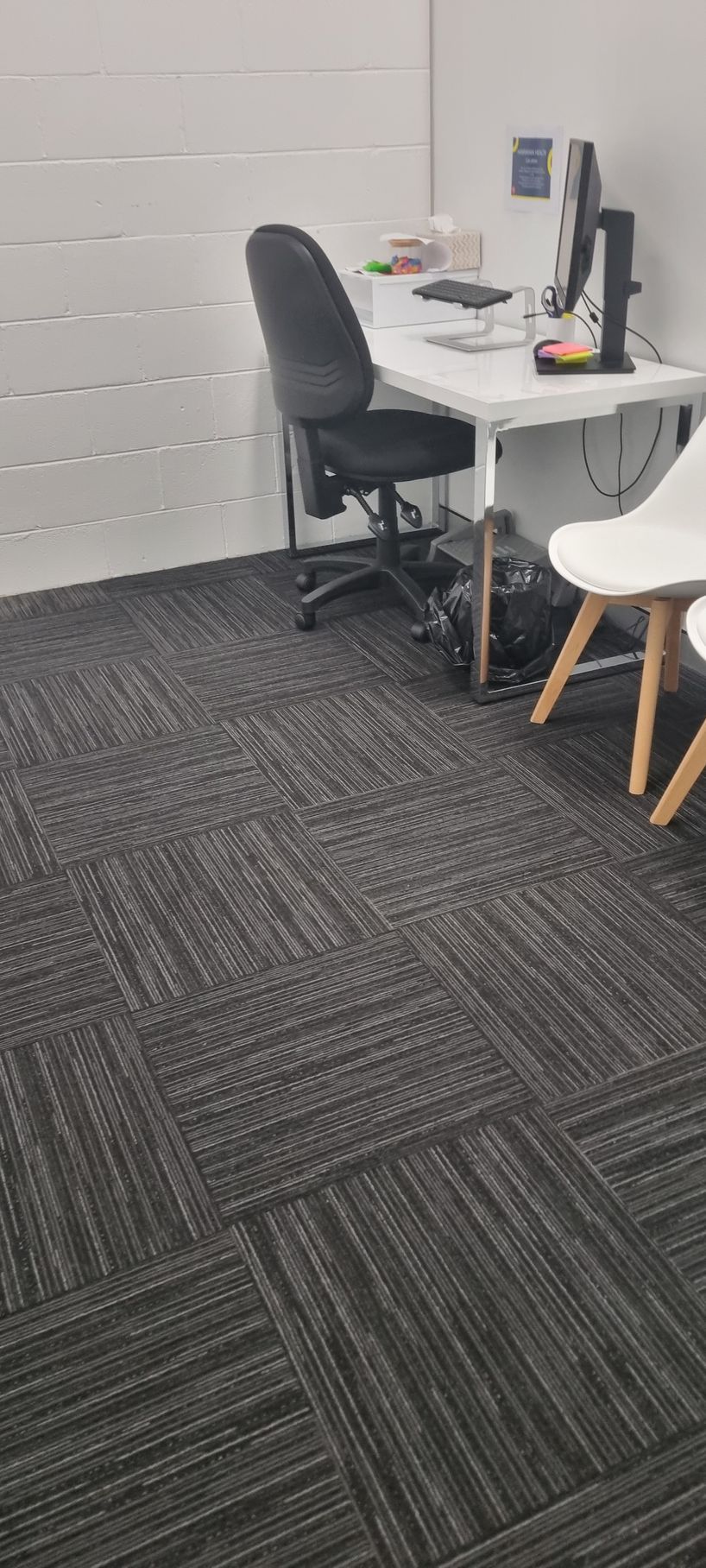 Office interior with a desk, chair, and carpeted floor — RWM Cleaning in Deception Bay, QLD