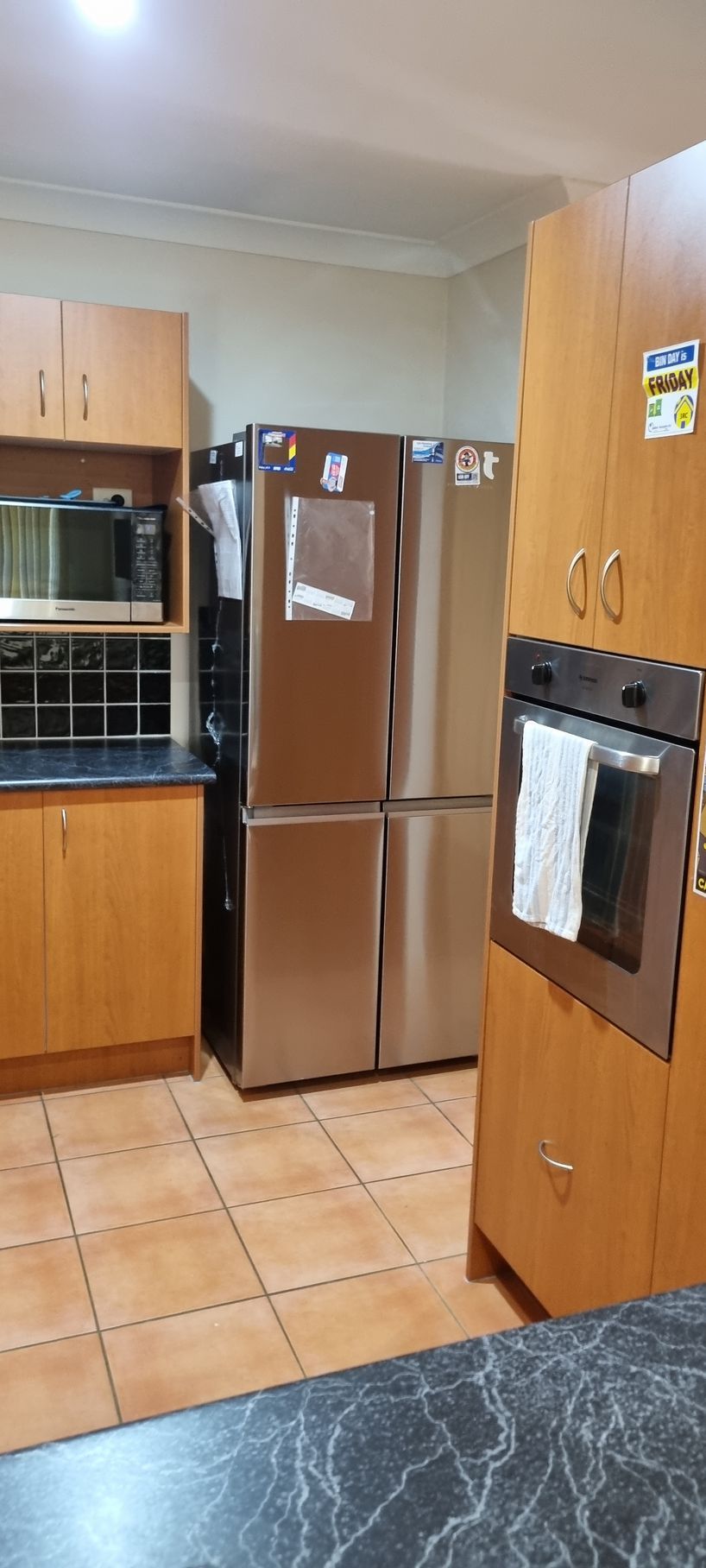 A Kitchen Featuring a Stainless Steel Refrigerator — RWM Cleaning in Deception Bay, QLD