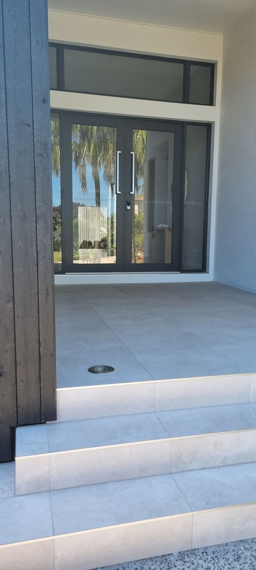 Exterior View of a Modern Building Entrance With Double Glass Doors — RWM Cleaning in Deception Bay, QLD