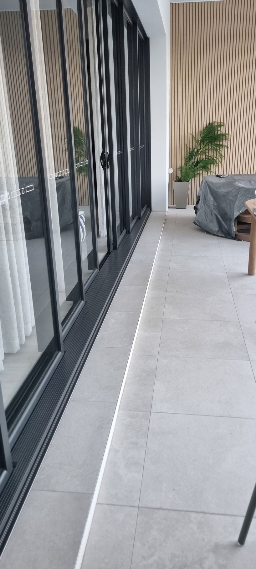 Modern Outdoor Patio Walkway with Glass Doors — RWM Cleaning in Deception Bay, QLD