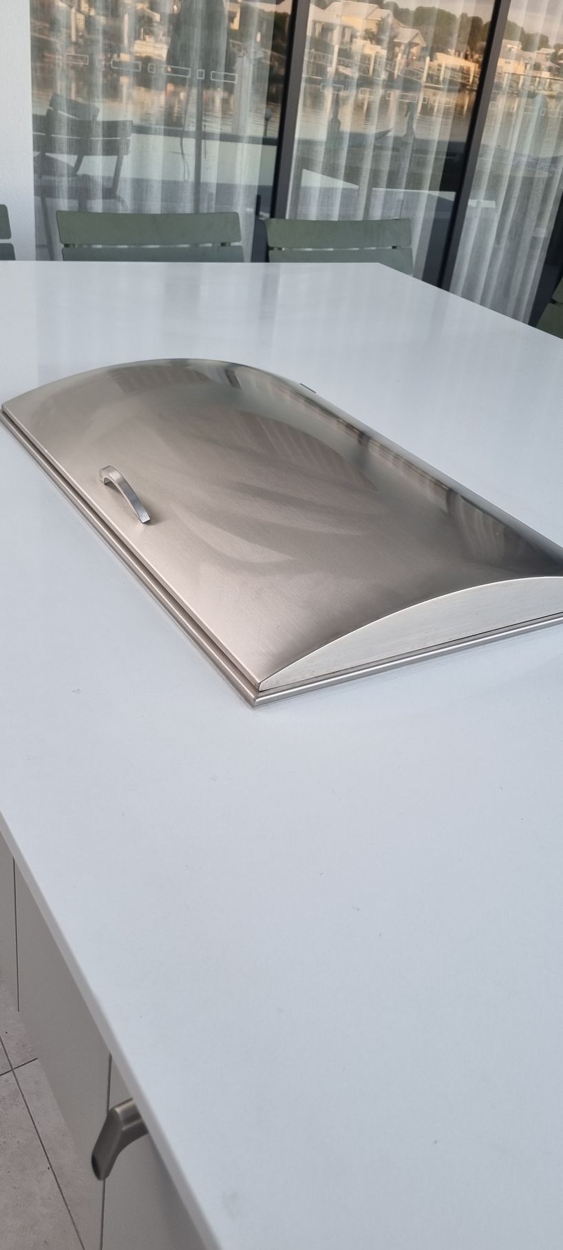Stainless Steel Lid on a White Table — RWM Cleaning in Deception Bay, QLD