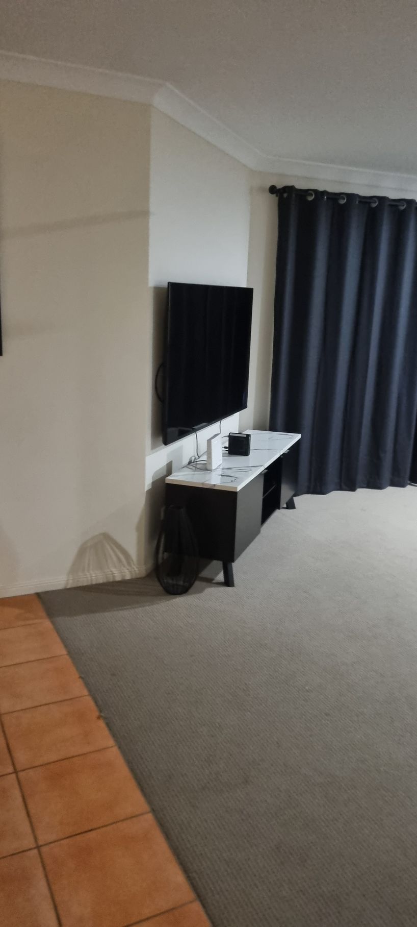 A Living Room With a Mounted TV — RWM Cleaning in Deception Bay, QLD