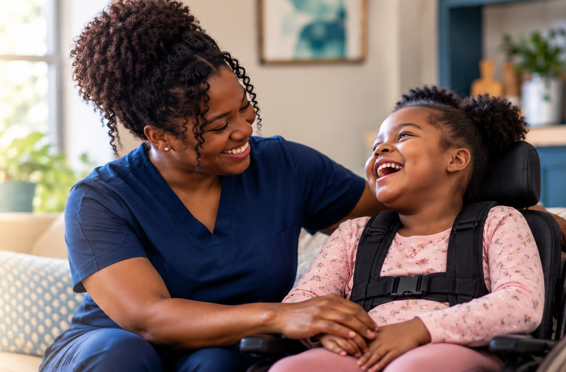 Woman smiling at laughing child in a wheelchair on a couch in a bright living room