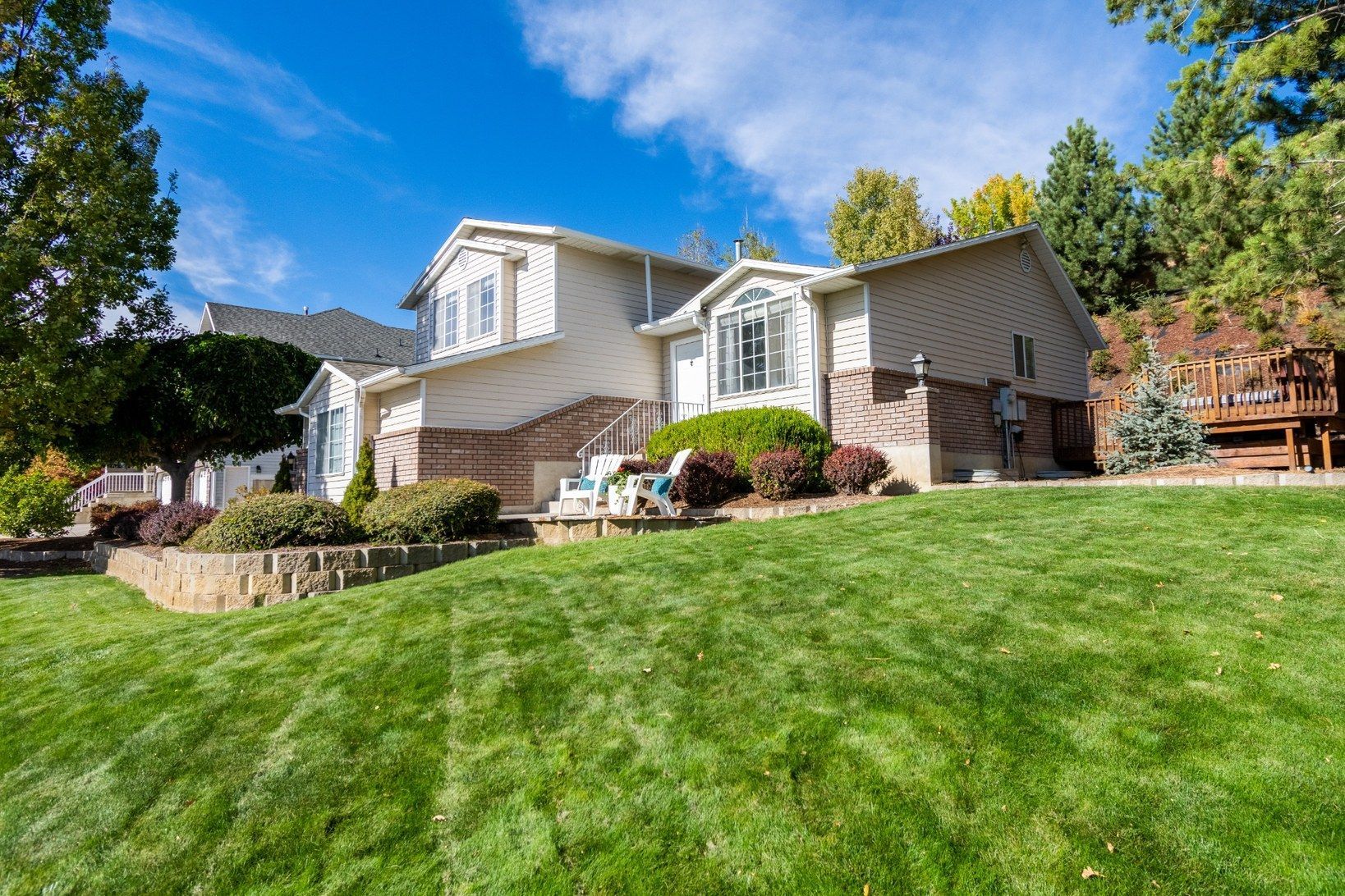 Residential home with professionally maintained green lawn