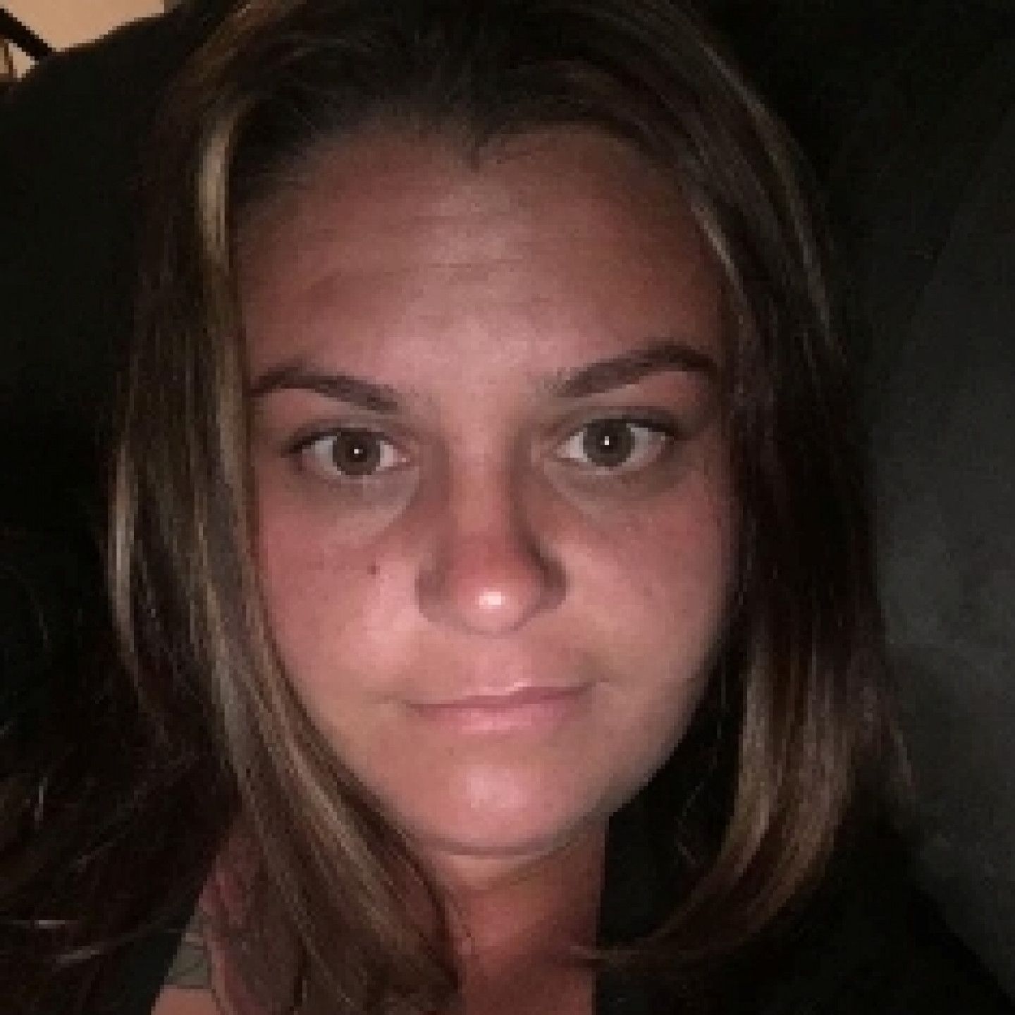 Woman with brown eyes, fair skin, and light brown hair looking at the camera.