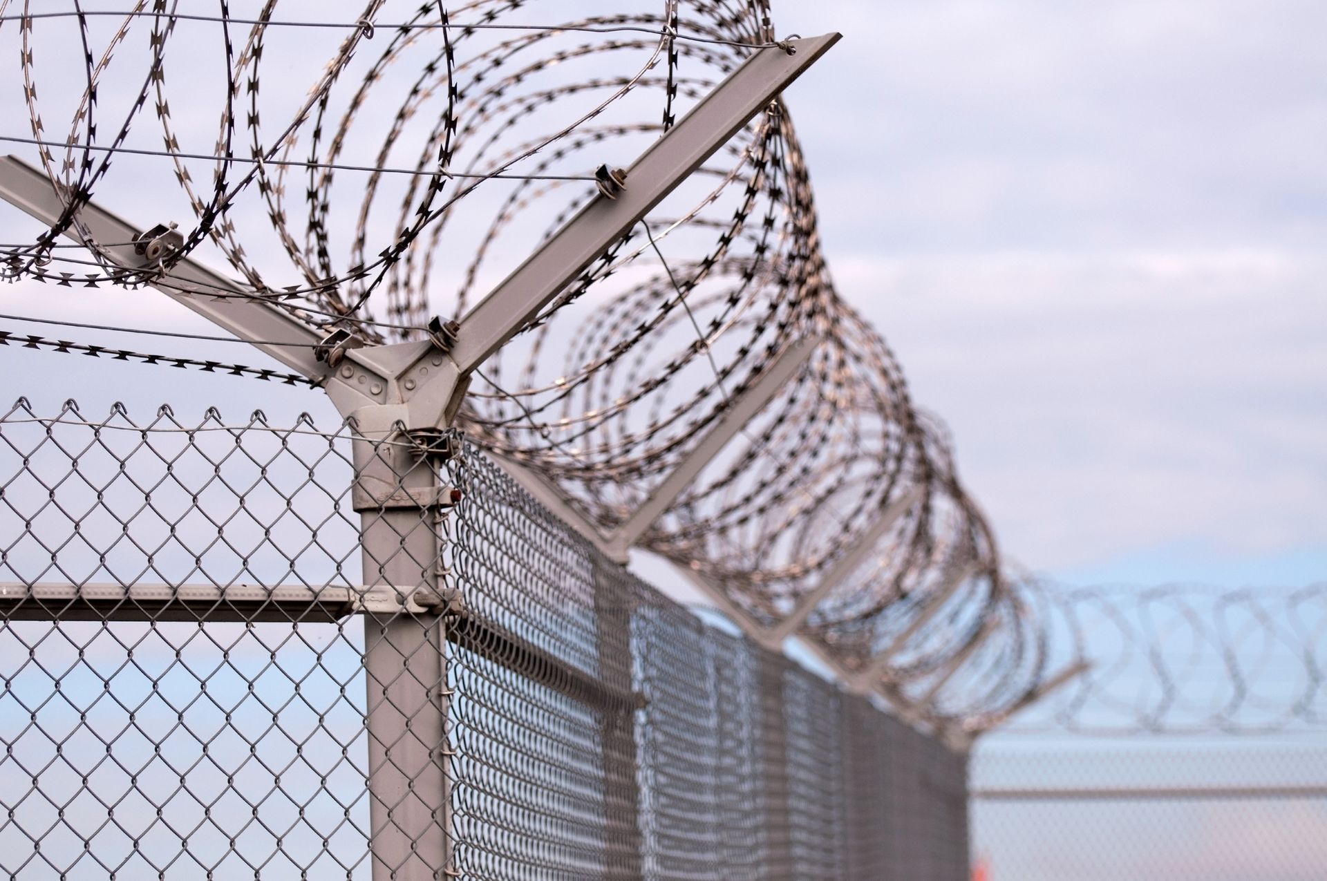 Barbed Wire High-Security Prison Fence - A & R Rent-A-Fence