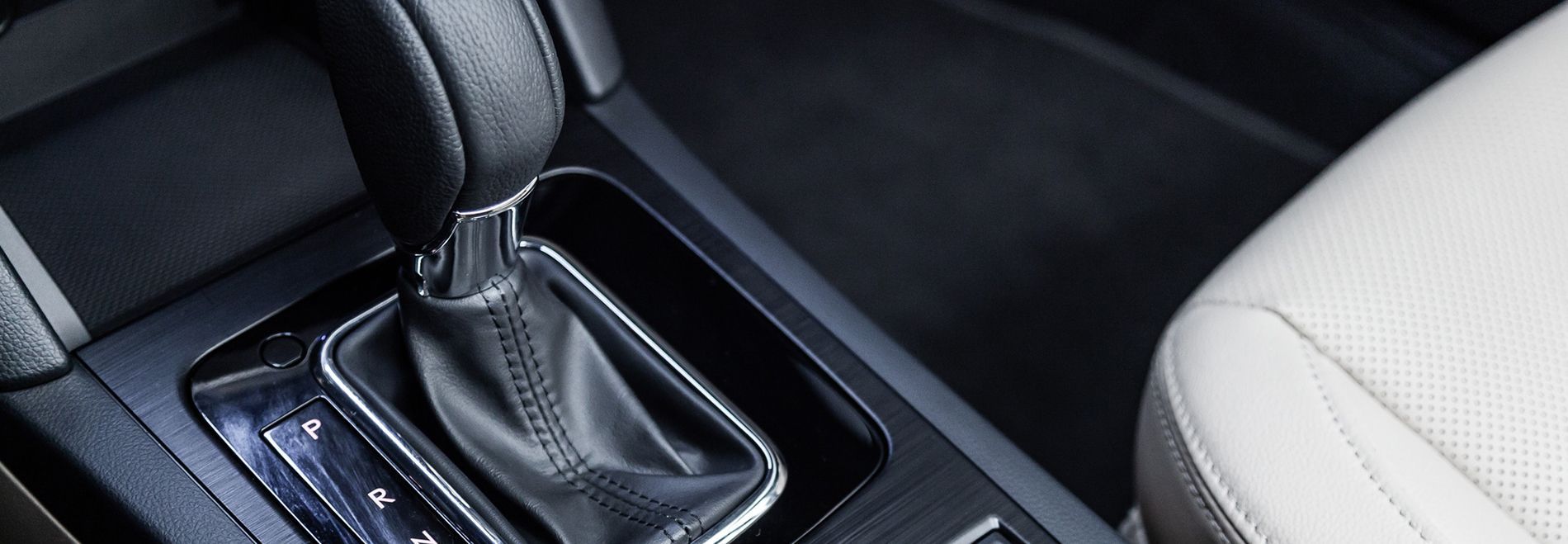 Car’s center console with automatic gear shift and black interior trim