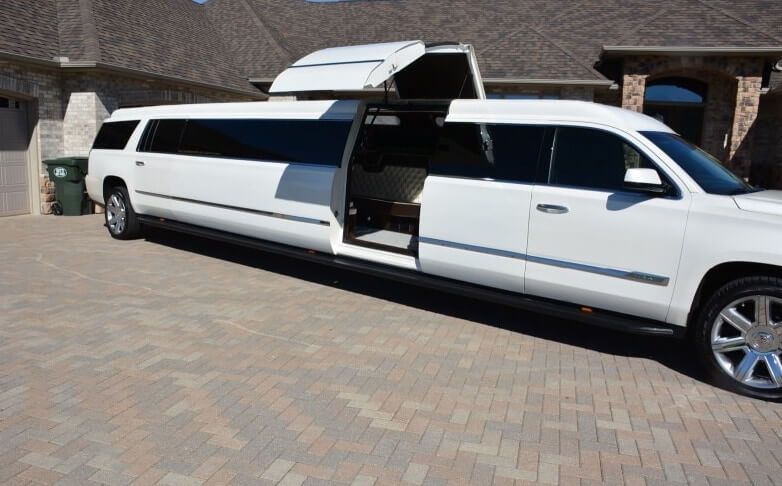 white Cadillac Escalade limo rental with jet doors dallas
