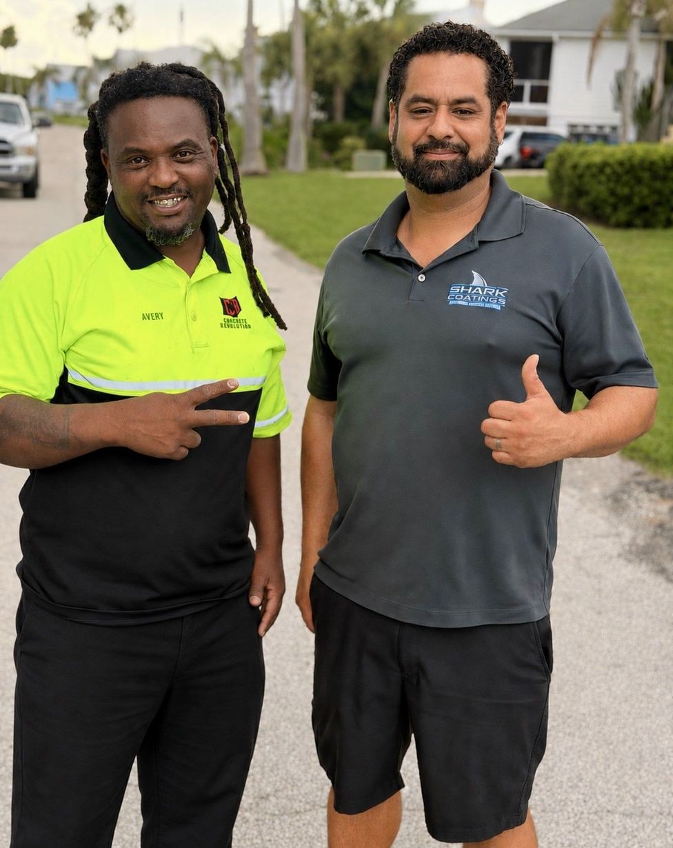 Concrete Renovations and Shark Coatings leaders smiling outdoors, one in a neon green and black shirt and one in a gray polo, both giving thumbs up.