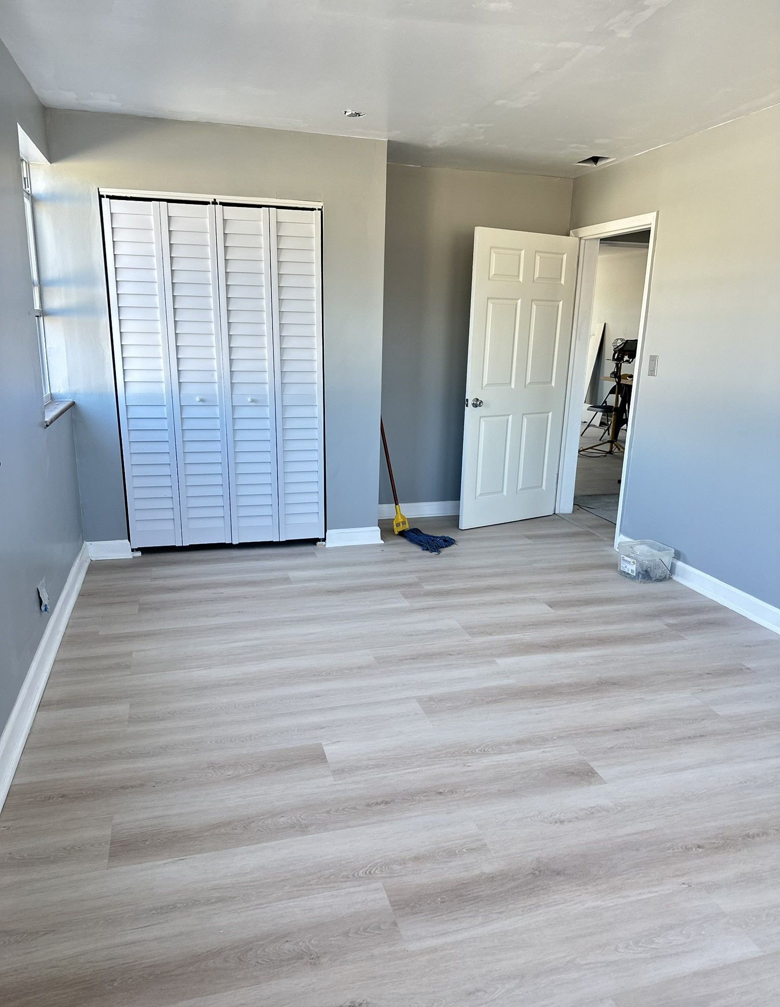 There is a mop in the middle of the room.