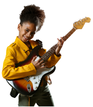 Smiling child in a yellow shirt playing an electric guitar on a white background