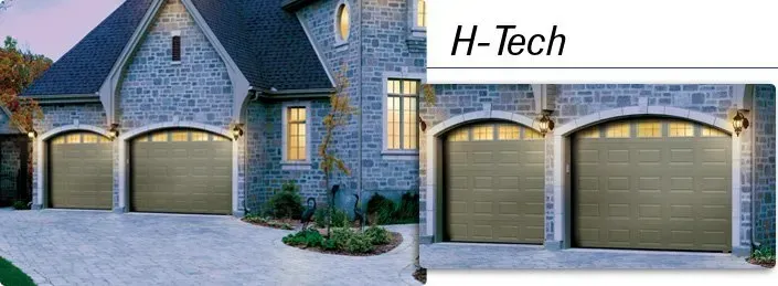 Stone house exterior with lit garage doors Stone house exterior with lit garage doors