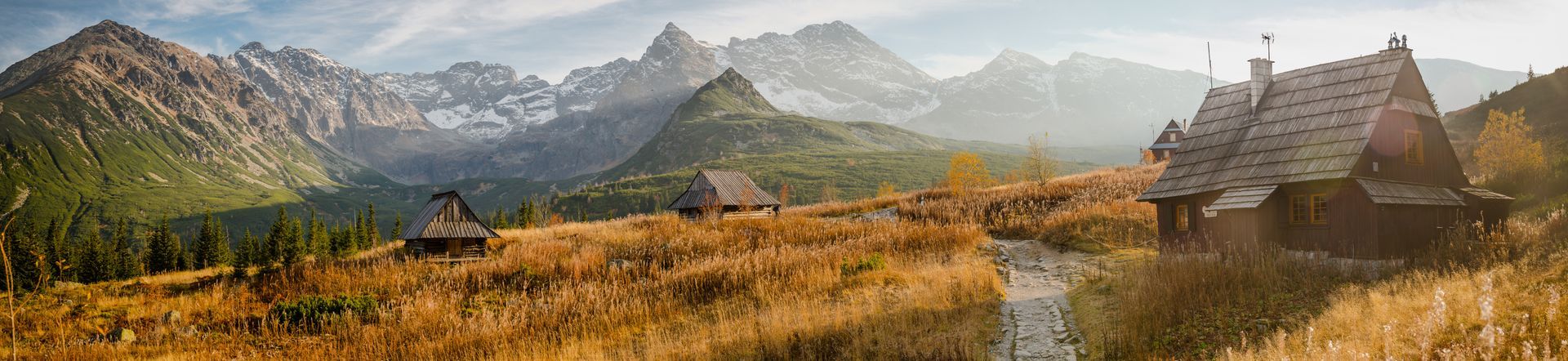 zakopane mountais, sunny weather, on first plan wooden house.