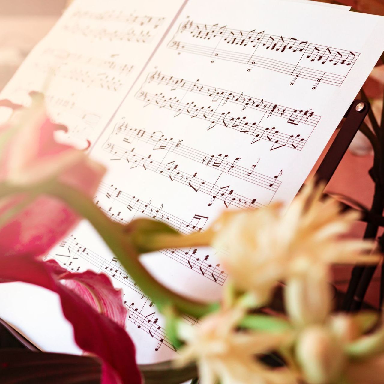 Music sheets with flowers behind them
