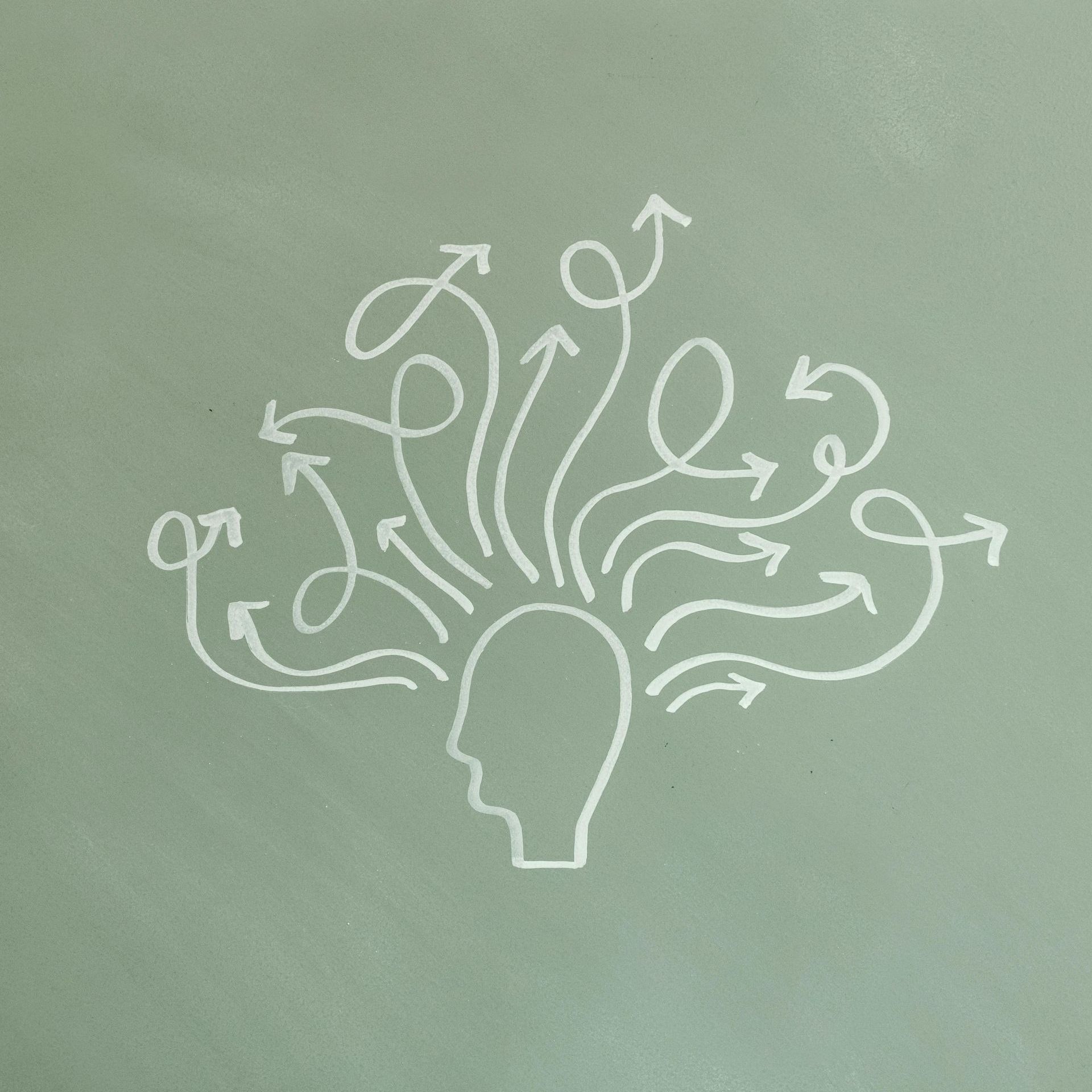 A drawing of a head with arrows coming out of it