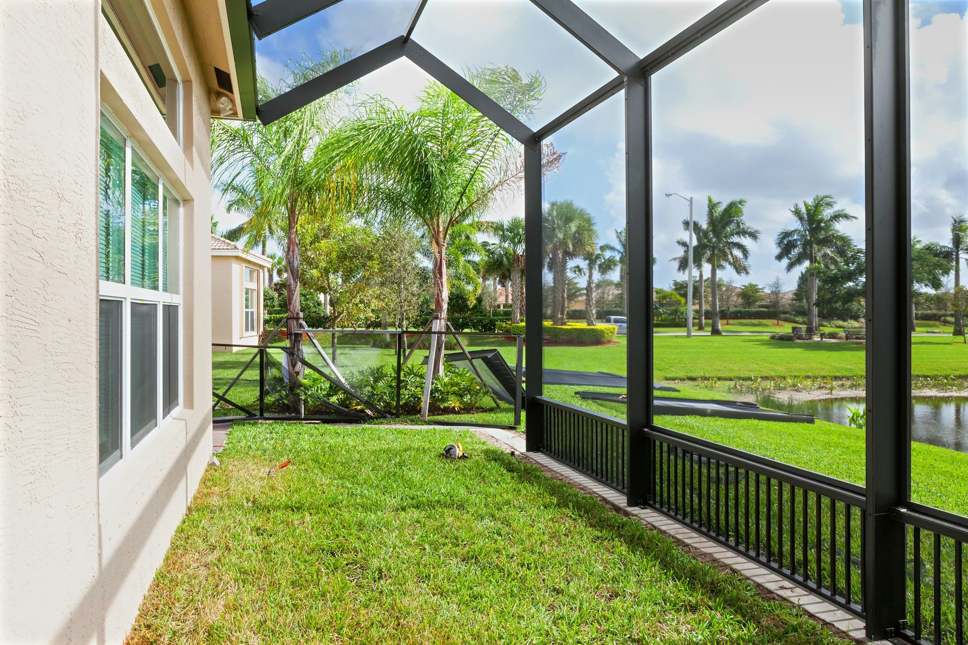A backyard view showcasing custom patio enclosures highlighting modern outdoor design