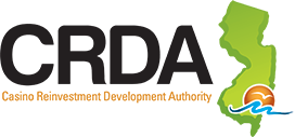 Logo of the Casino Reinvestment Development Authority (CRDA), featuring text next to a green map of New Jersey.