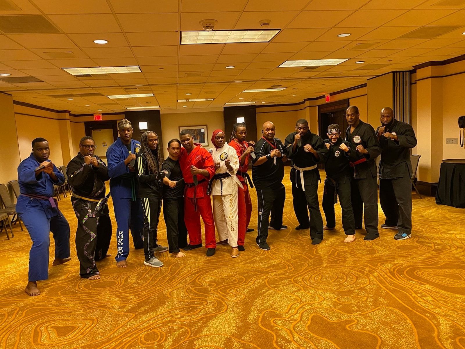 A group of people are posing for a picture in a room.