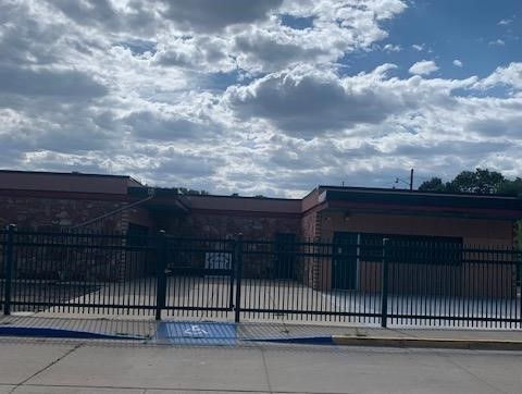 there is a handicapped parking spot in front of the building .