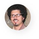 A man with glasses and a beard is smiling in a circle.
