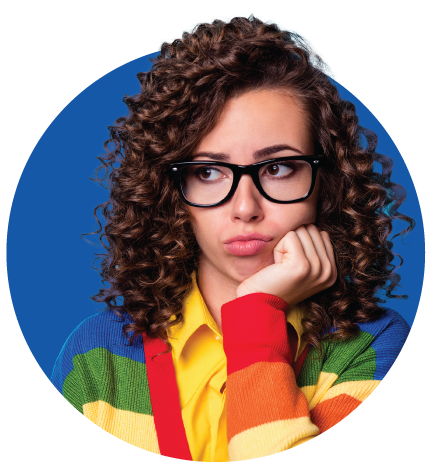 A woman with curly hair is wearing glasses and a colorful sweater