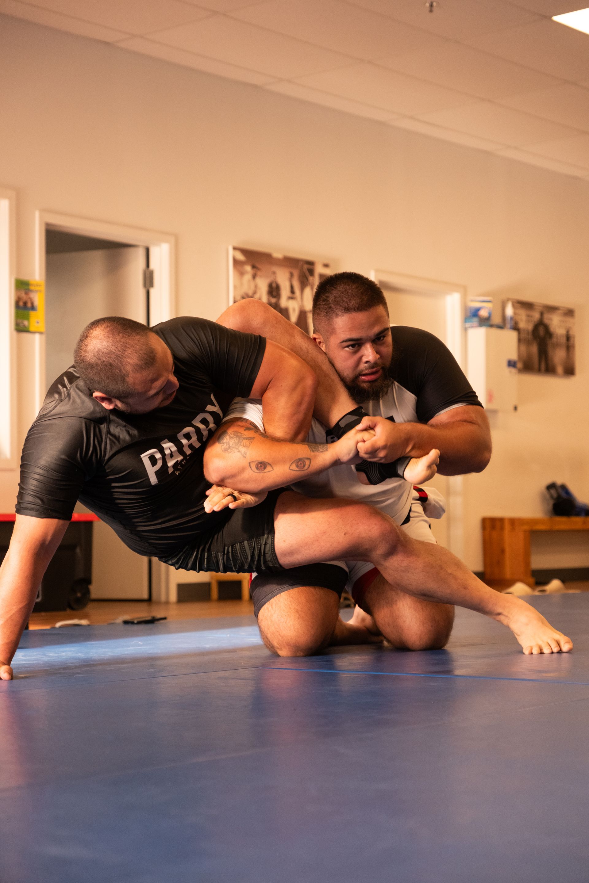 Adult students drilling Brazilian Jiu-Jitsu technique at Montgomery Brazilian Jiu-Jitsu.