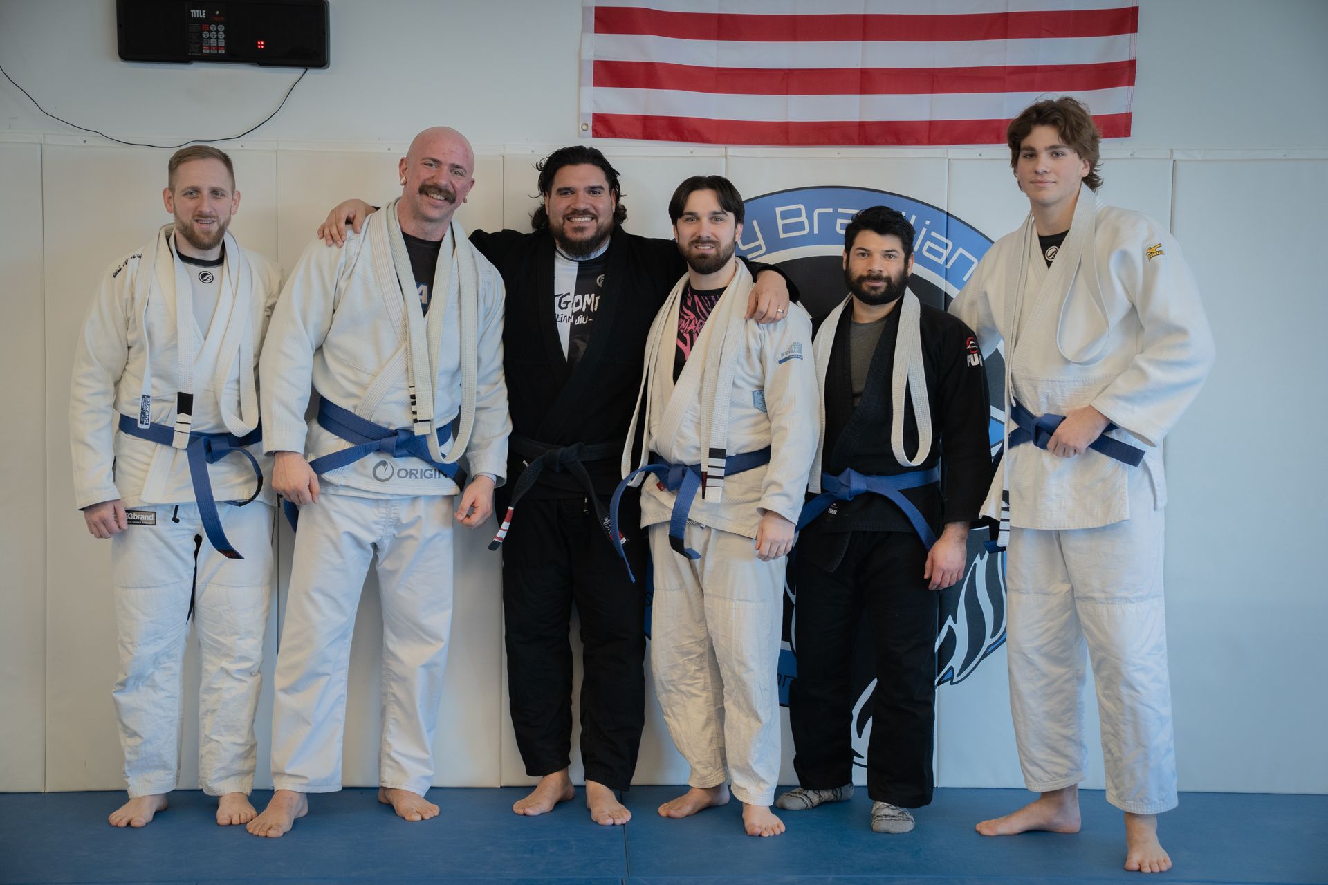 Members improving fitness, discipline, and self-defense through Brazilian Jiu-Jitsu at Montgomery Brazilian Jiu-Jitsu.