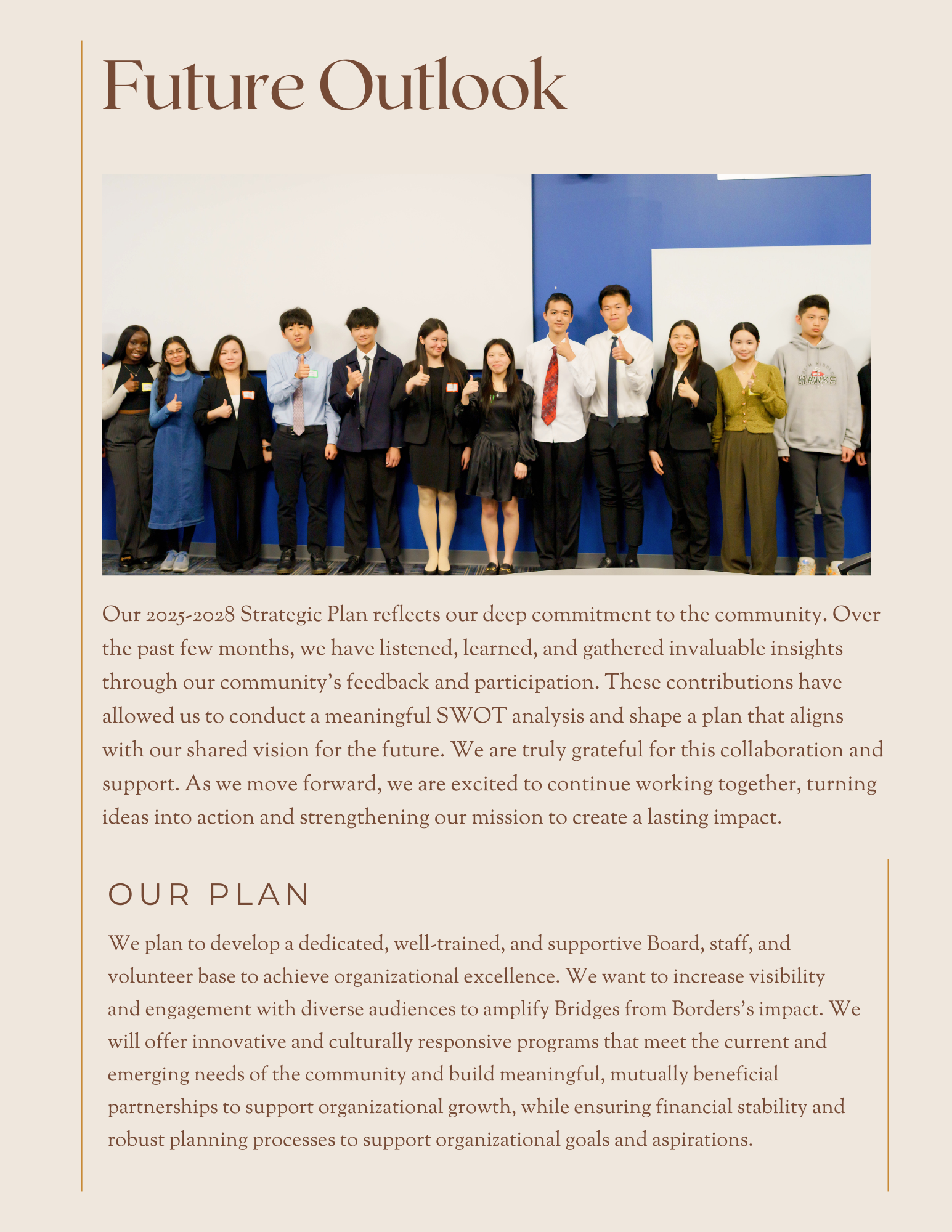 Group standing on a stage beside a blue backdrop under the heading “Future Outlook.”