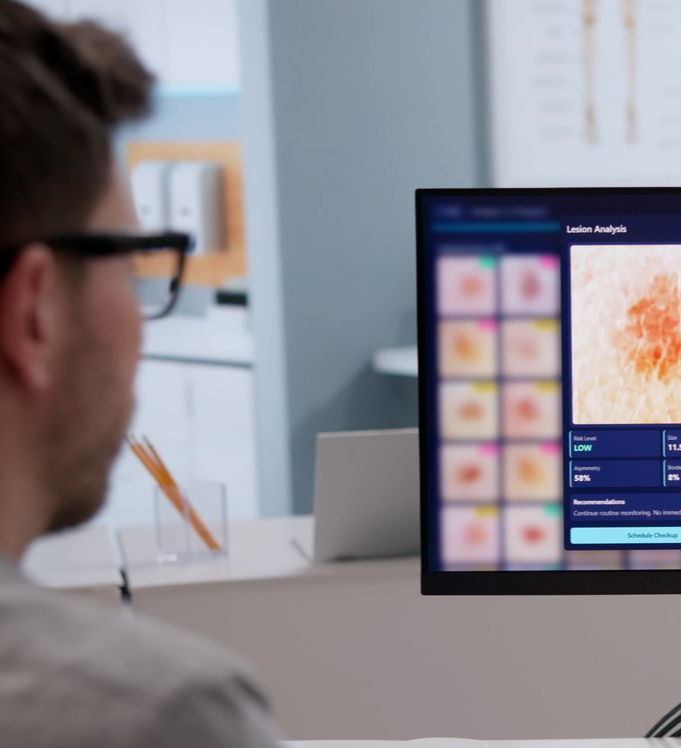 Dermatologist Thoroughly Inspects Male Patient's Skin