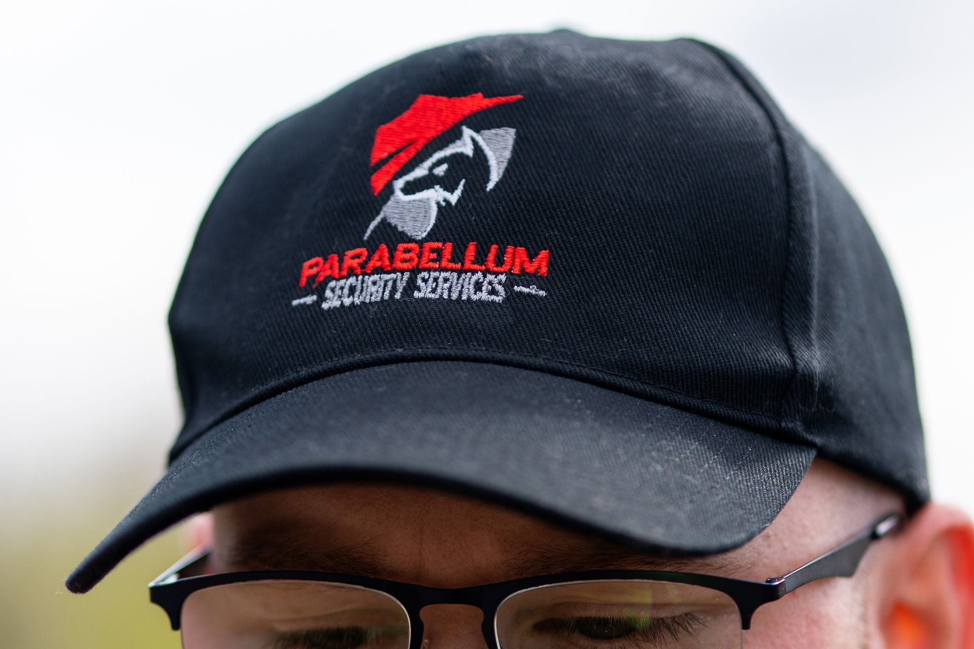 Society Guard wearing branded cap 