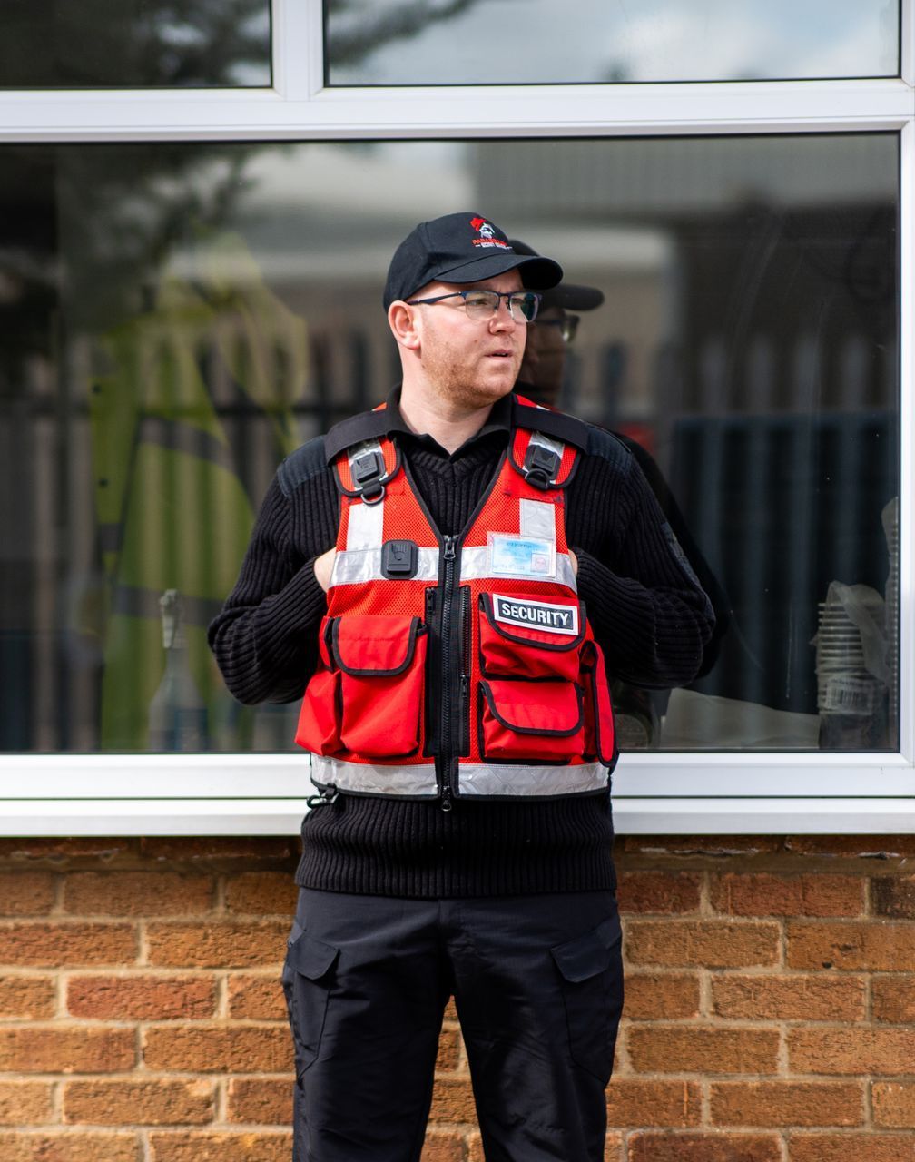 Security officer standing at gatehouse 