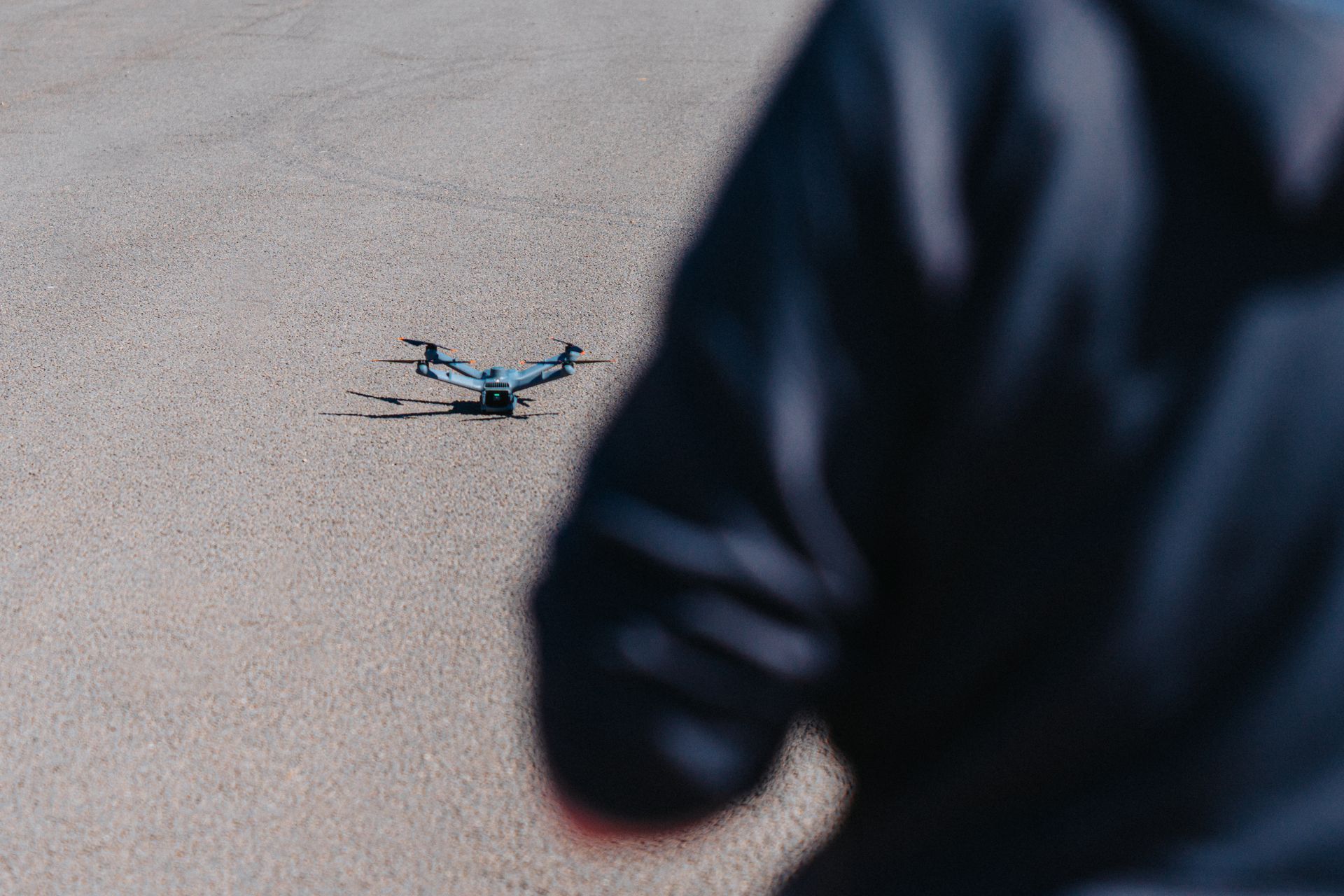 Drone on the ground ready to take of with security drone operator 