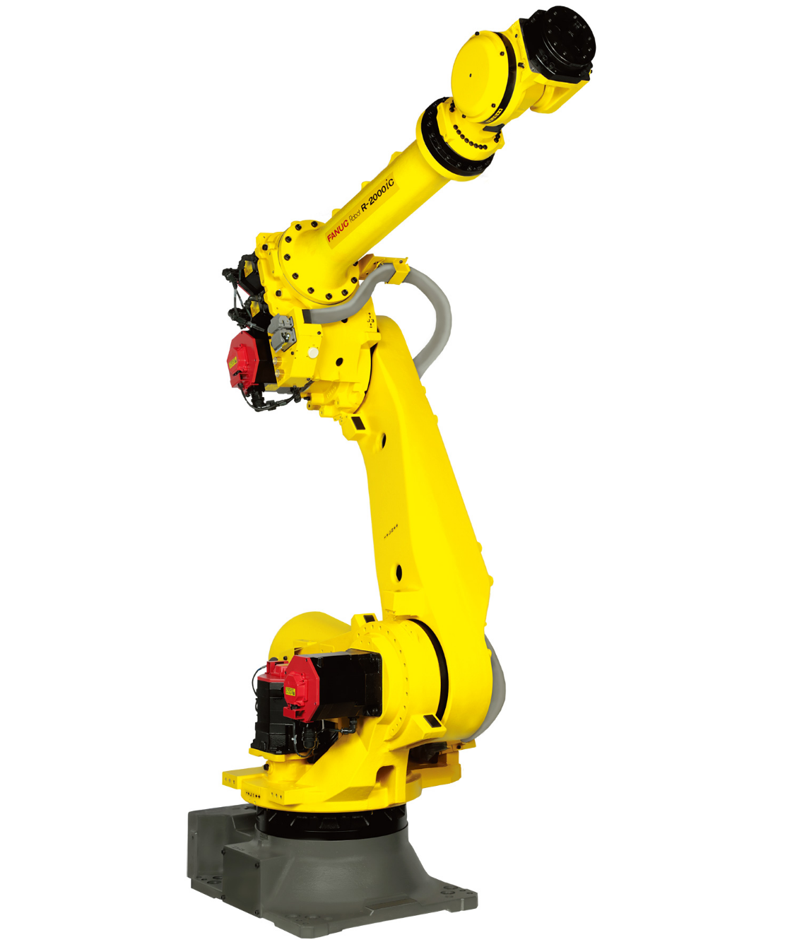 A yellow robotic arm is sitting on a white surface.