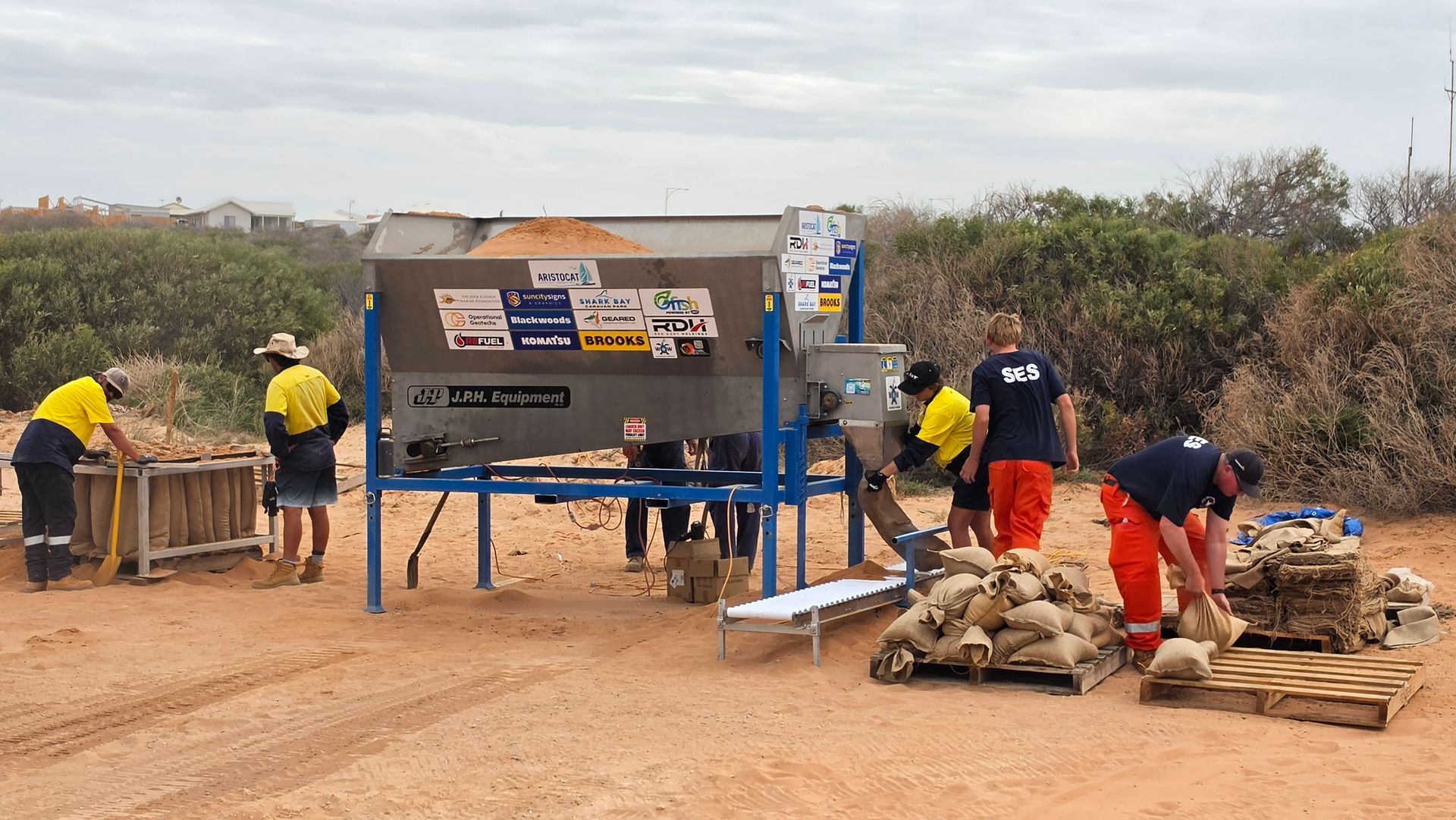 Sandbagging machine in use for cyclone preparation in Monkey Mia.