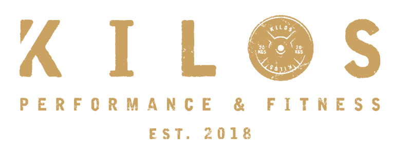Logo for Kilos Performance & Fitness. Gold text with a barbell symbol, and "EST. 2018".
