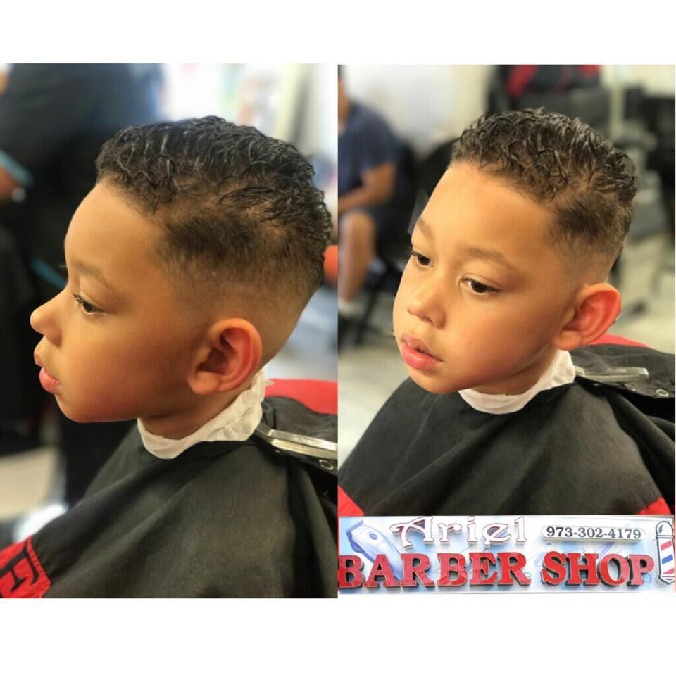 Boy’s fresh fade haircut shown in side-by-side salon photos, wearing a barber cape