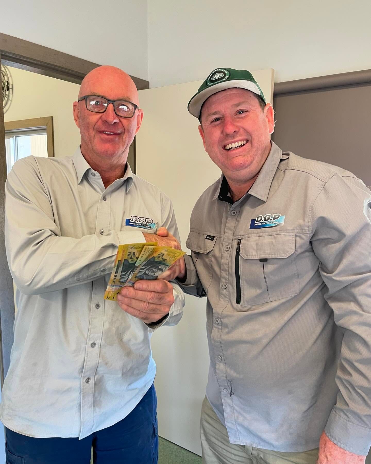 A Person is Installing Drain Pipes in a Trench — Daniel Gray Plumbing in South Murwillumbah, NSW