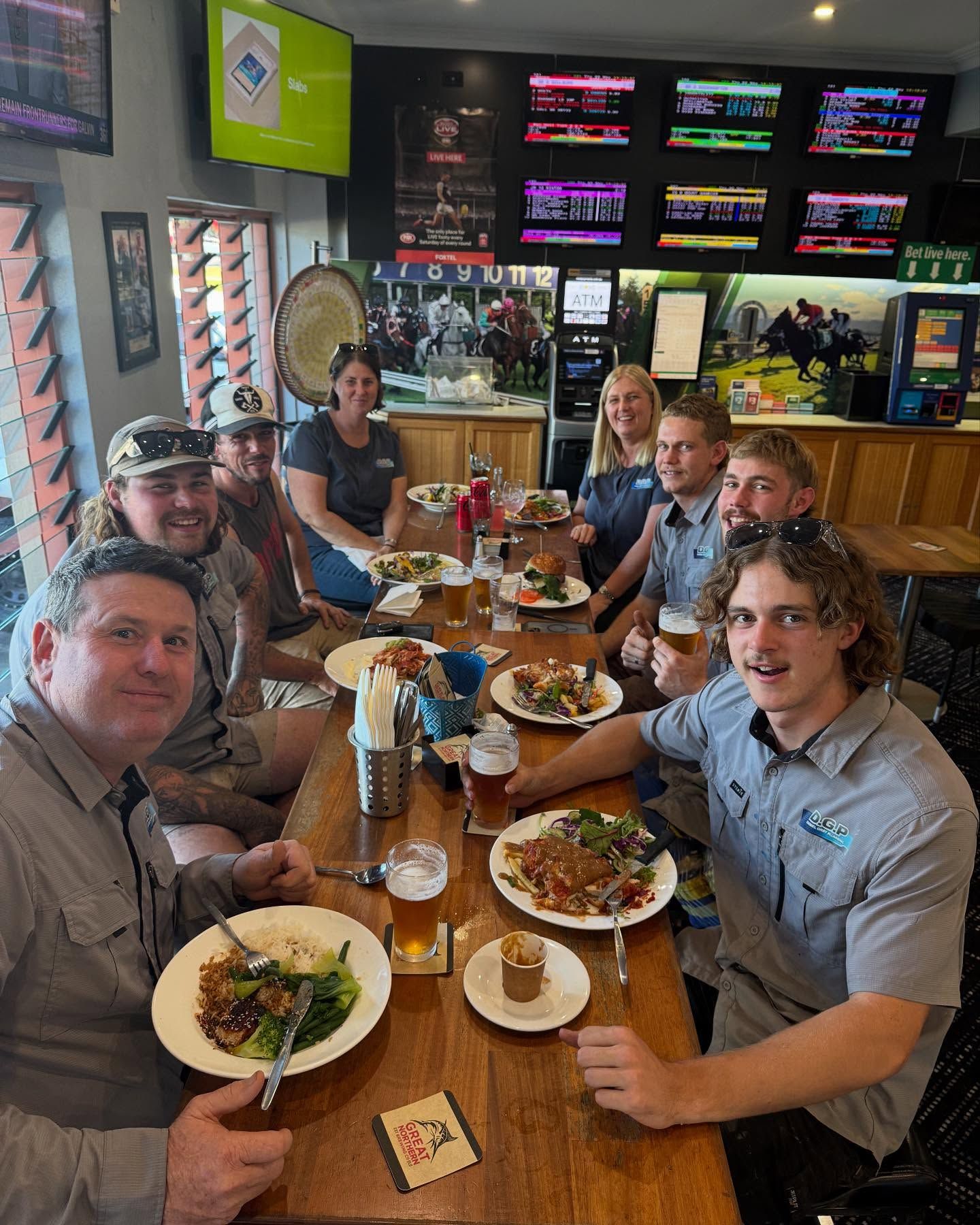 A Plumber is Fixing a Pipe With a Wrench in a Bathroom — Daniel Gray Plumbing in South Murwillumbah, NSW