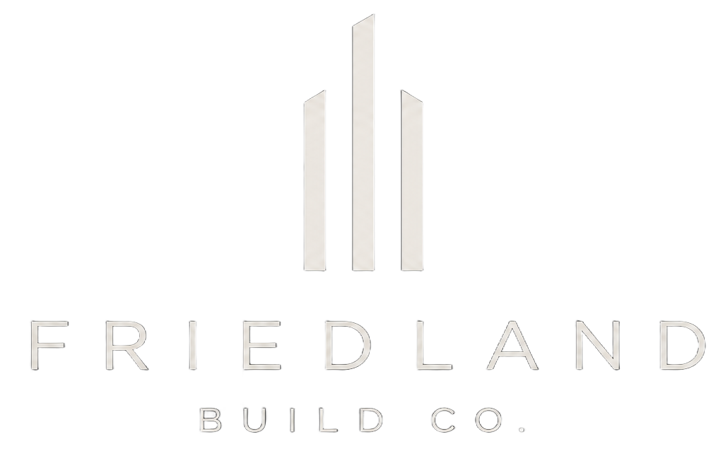 Friedland Build Co. logo with minimalist white skyscraper icon on a light background