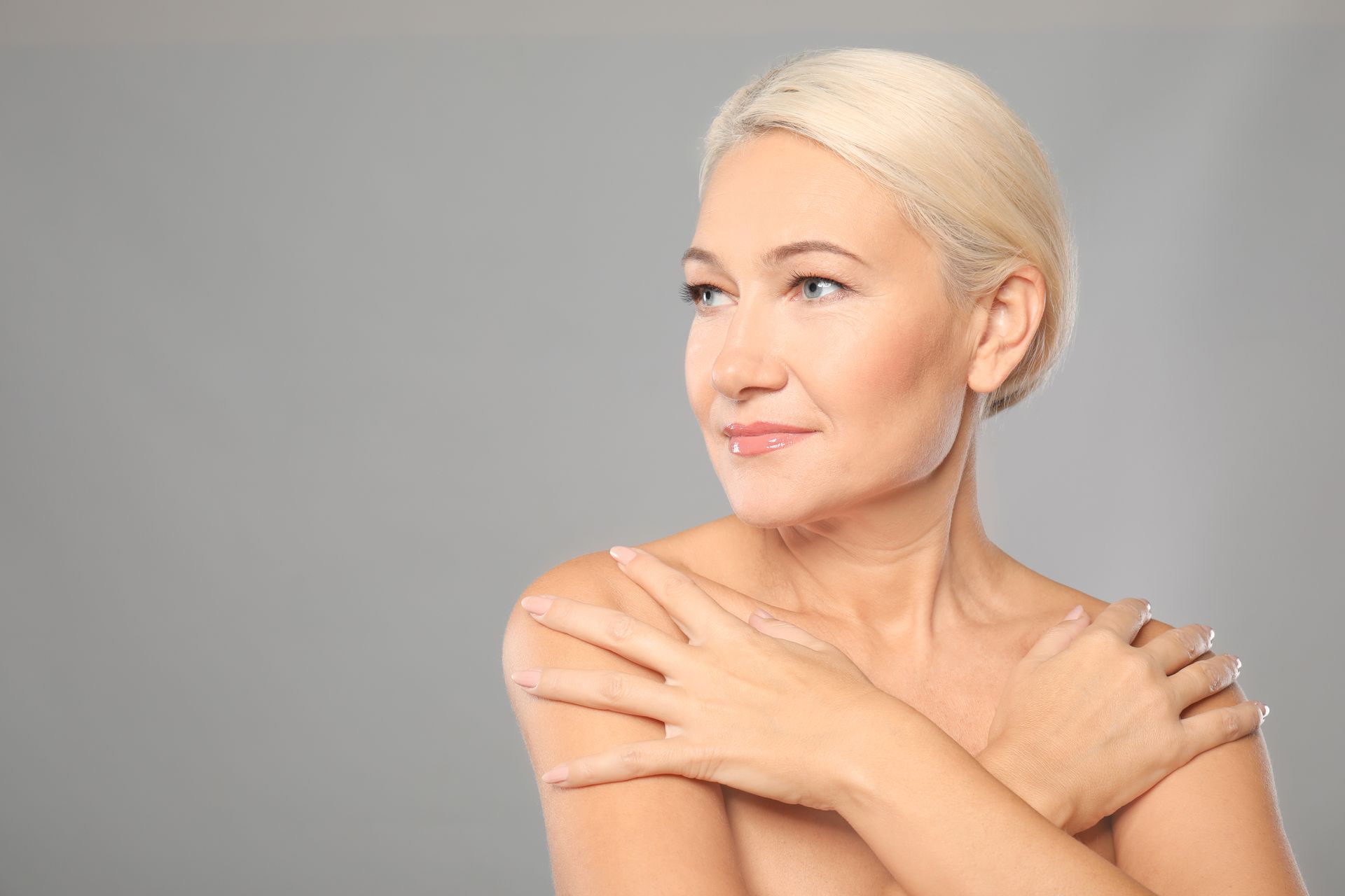 a woman touching her shoulders