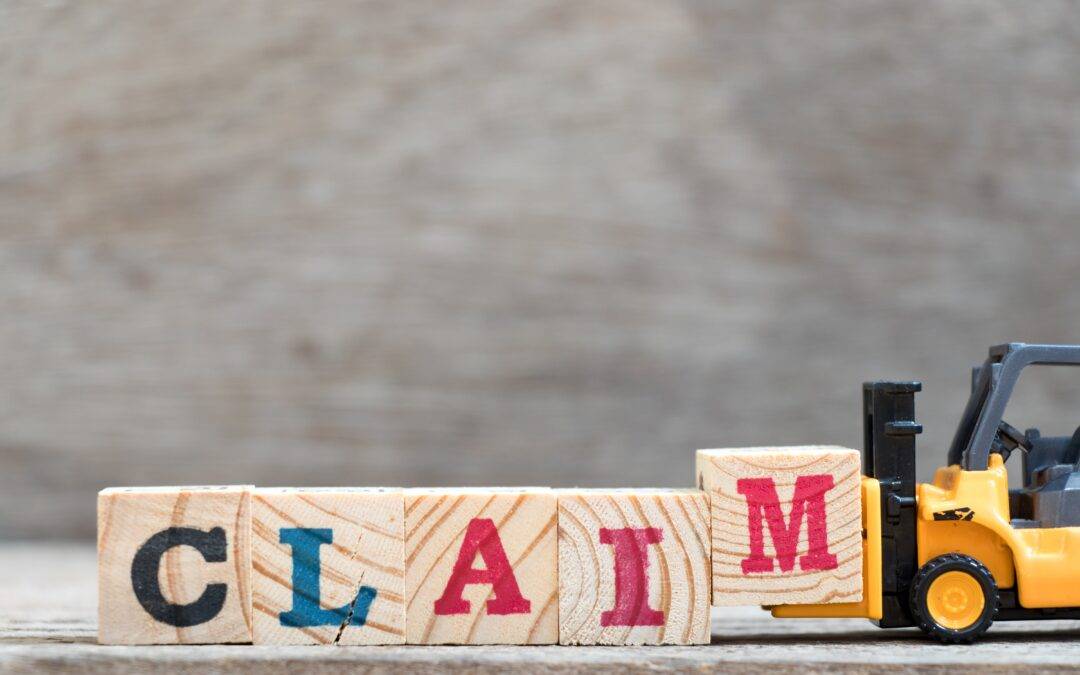 the word claim is written on wooden blocks next to a toy forklift