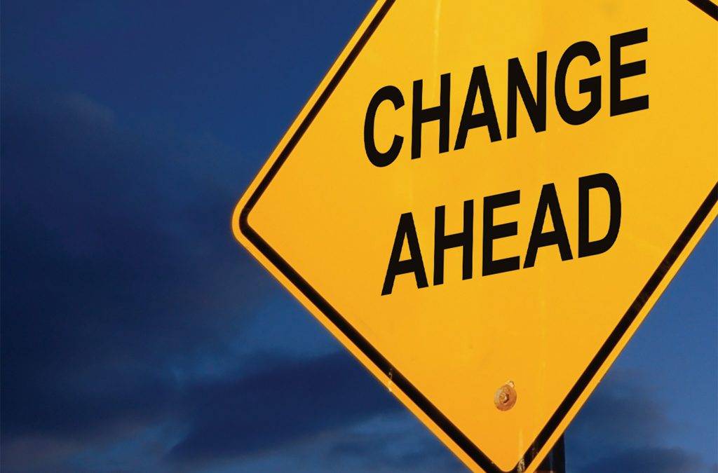 a yellow sign that says change ahead on it